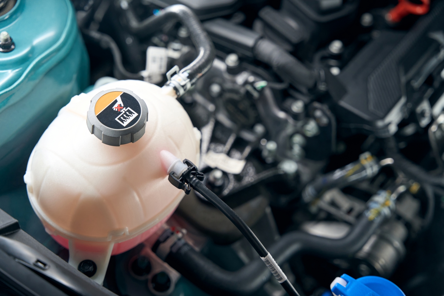 Technician inspecting and repairing a car's fuel system at DriveTime Automotive in Salem, OR.
