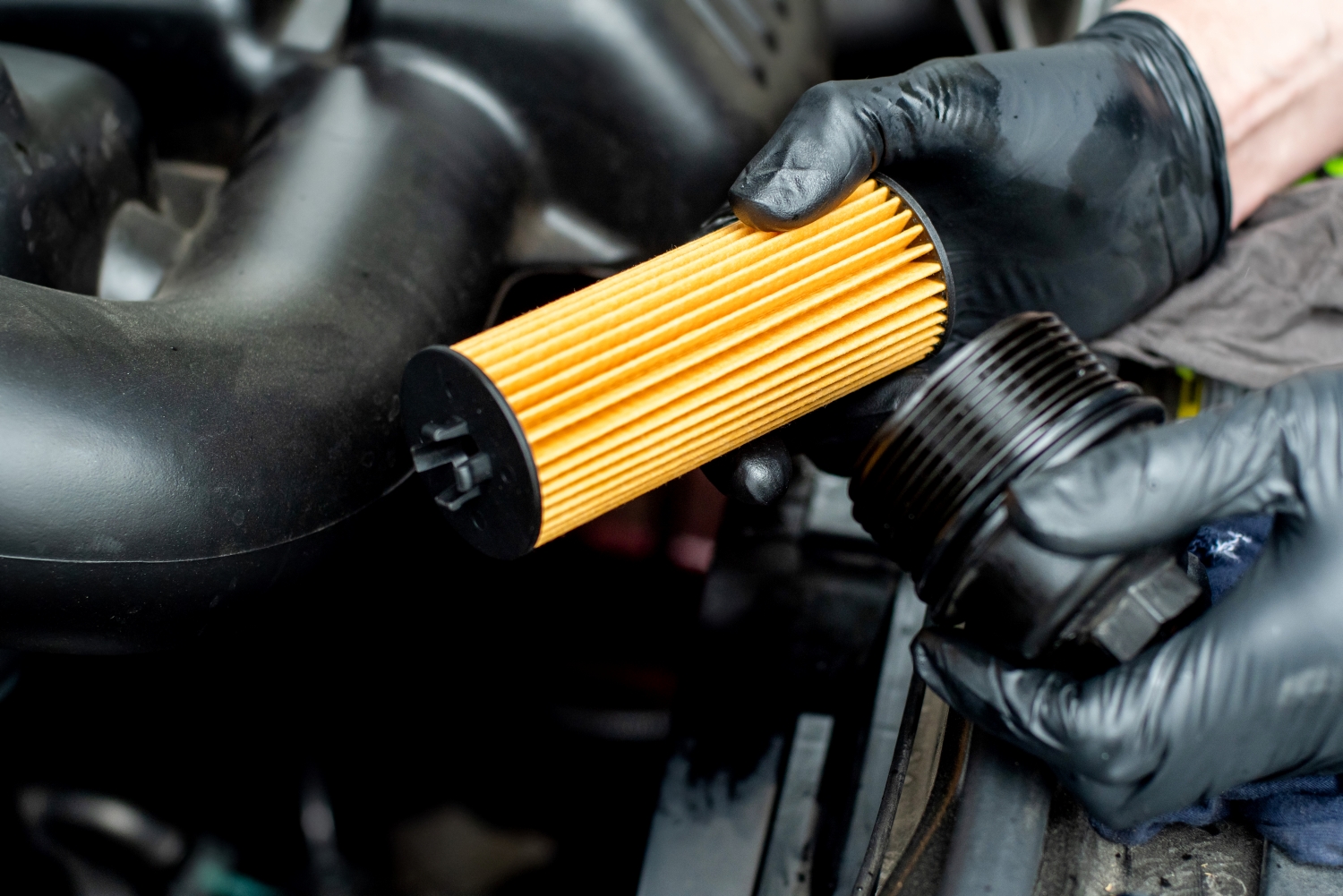 A mechanic performing oil change service.